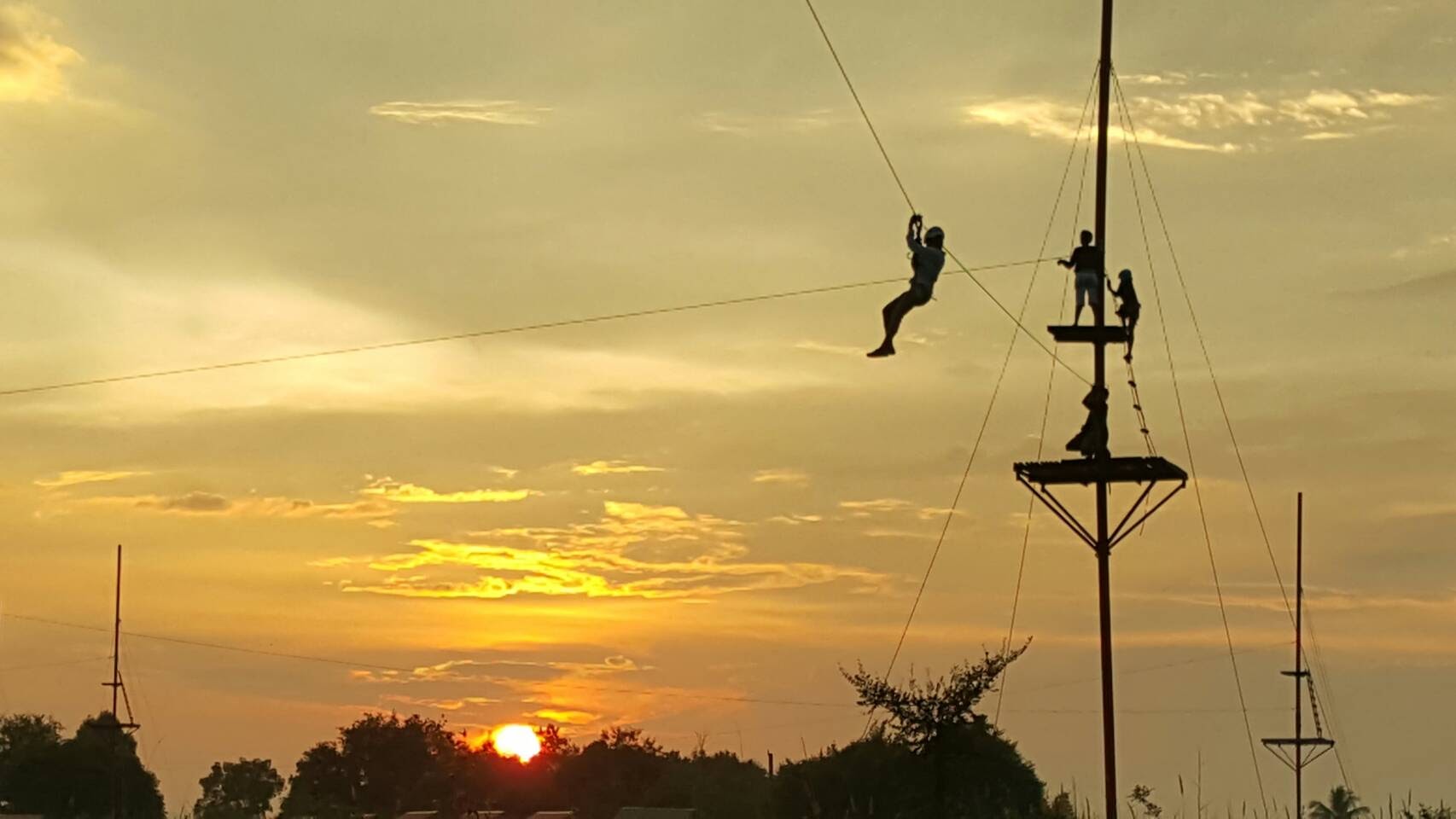 Tarzan zipline course at sunset